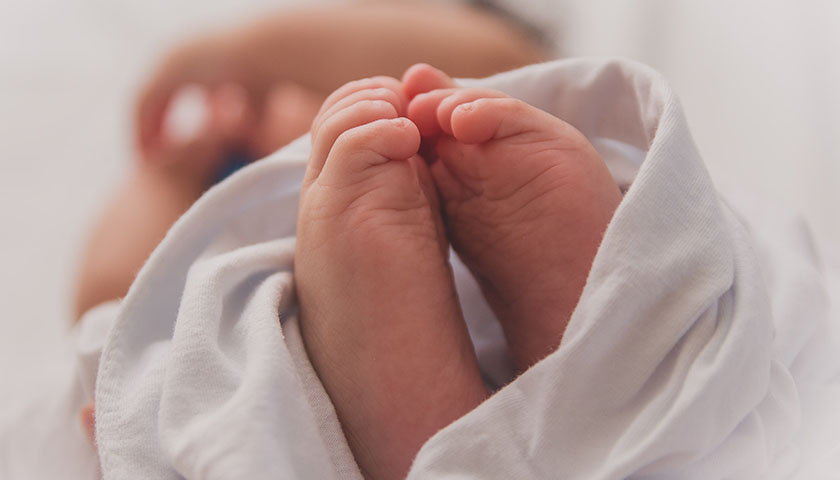 Baby covered with blanket