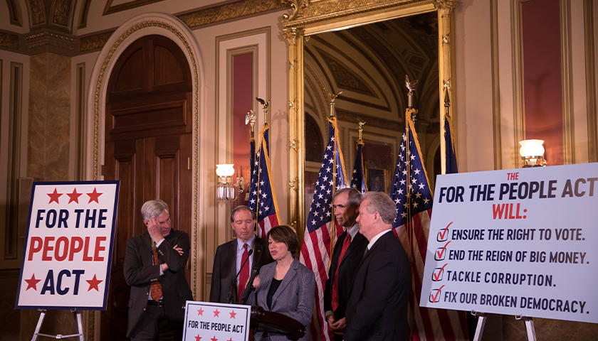 Legislators gather to discuss For The People Act.