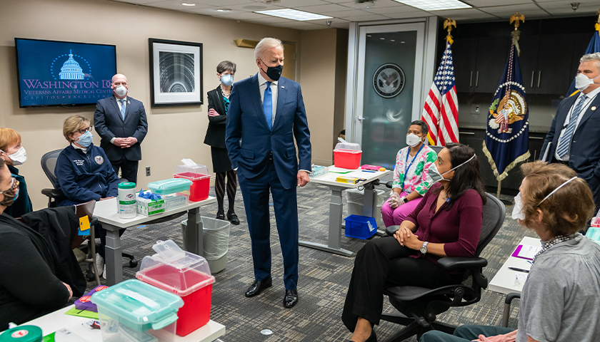 President Joe Biden talks to Veterans and VA staff members during a briefing on the vaccine process Monday, March 8, 2021, at the Washington DC Veterans Affairs Medical Center in Washington, D.C.