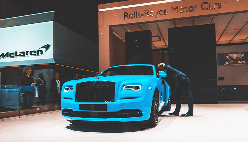 blue Rolls Royce at a dealership