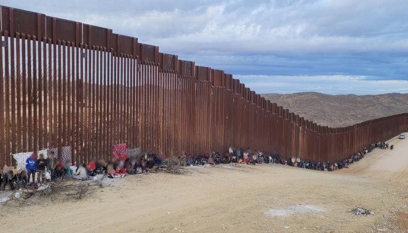 Illegal Immigrants by Border Fence