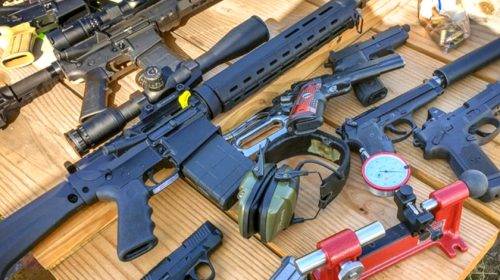 A selection of modern firearms on a table